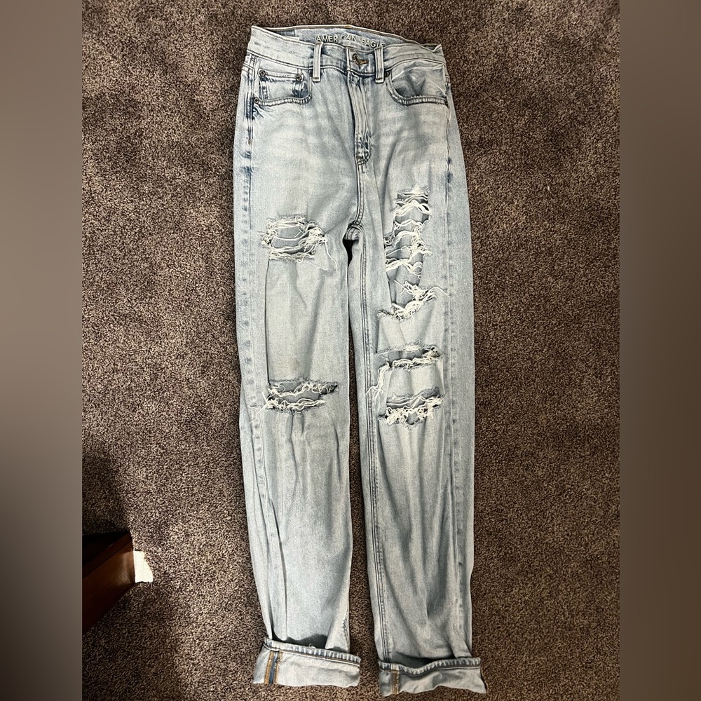 American eagle size 0 baggy jeans distressed, and came with rips light wash